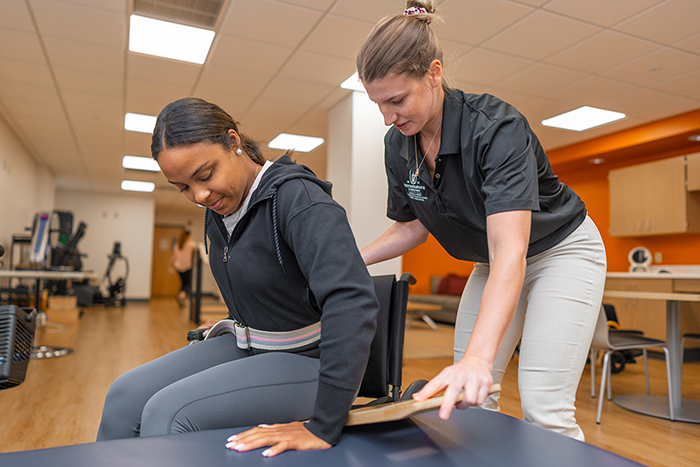 SBU Occupational Therapy students practice functional transfers during a skills lab.